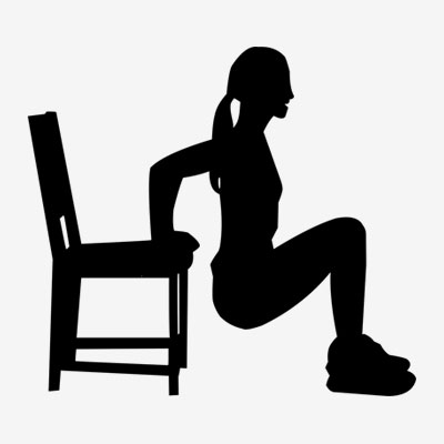 Silhouette of woman doing tricep dips on a chair