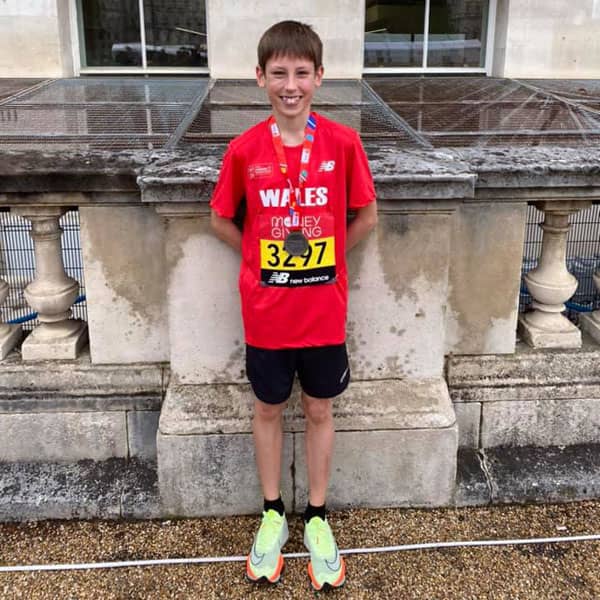 Boy with athletics medal