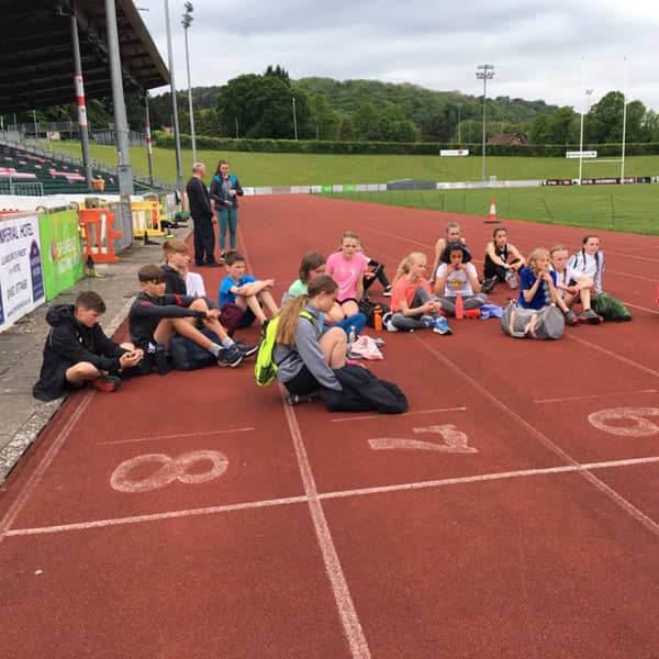 Children on athletics track in Colwyn Bay