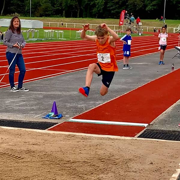 Boy doing long jump